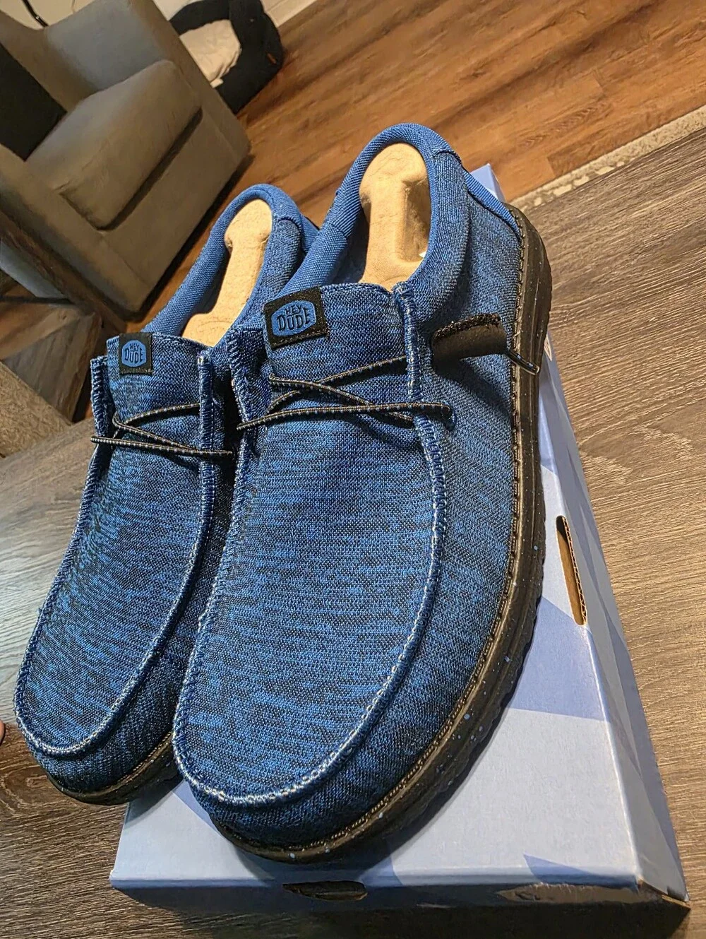 Hey Dude Men's Blue Casual Moccasin Shoes With Black Soles And Logo.